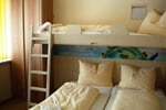 room with 3 beds