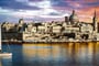panoramic view of Valetta over sunset and with a sail boat. Malta_shutterstock_511520416