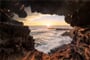 Watching the Sunset through the wonderful Ana Kakenga Cave on Rapa Nui, Isla de Pasca, Easter Island, Chile_shutterstock_6777120491
