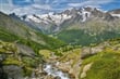 Výhled z květinové cesty, na čtyřtisícovky (z leva) Allalinhorn, Alphubel, Taschhorn a Dom 4545mnm (druhá nejvyšší hora Švýcarska)