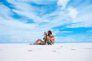 Young couple on an empty beach