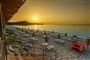 Východ slunce na pláži, Pula, Sardinie