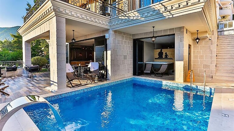 Hotel Boutique Tate: fotografie vybavení exteriérů a interiérů ubytování.