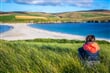 skotsko Shetland Islands, Young woman at St Ninian's Beachshutterstock 1139632499