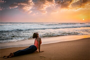 woman practices yoga asana urdhva mukha svanasana 2023 11 27 05 10 17 utc