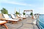 white-pier-deck-chairs-umbrellas-sea-prive-baldehin-palm