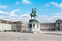 statue-man-horse-stands-front-building