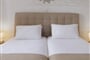 hotelnefeli-gardenview-doubleroom-bed-605x465