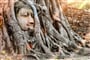 Ayutthaya Buddha Head statue with trapped in Bodhi Tree roots at Wat Maha That (Ayutthaya). Ayutthaya historical park Thailand. Vintage effect._shutterstock_683138305
