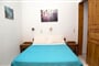 Apartmánový dům Perigiali: fotografie vybavení exteriérů a interiérů ubytování.
