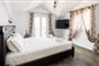 Aparthotel Stellatos House: fotografie vybavení exteriérů a interiérů ubytování.