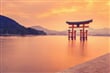 The famous orange floating shinto gate (Torii) of Itsukushima shrine, Miyajima island of Hiroshima prefecture, Japan at sunset._shutterstock_302808803
