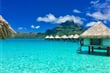 Overwater bungalows of a luxury resort providing a view on the Otemanu, Bora Bora, Tahiti, French Polynesia_shutterstock_638658136