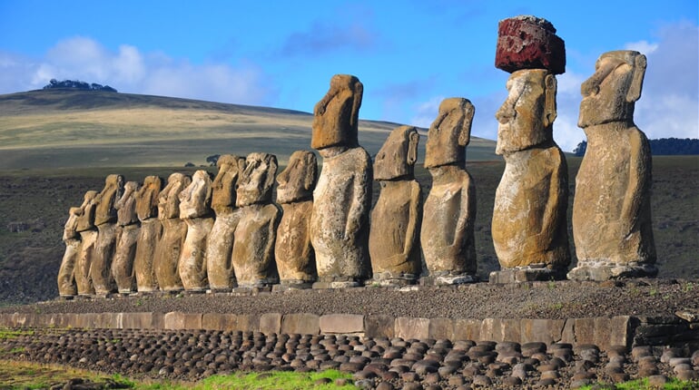 Group of 15 restored moai at Tongariki, Easter Island, in the afternoon sunshine_shutterstock_866725271