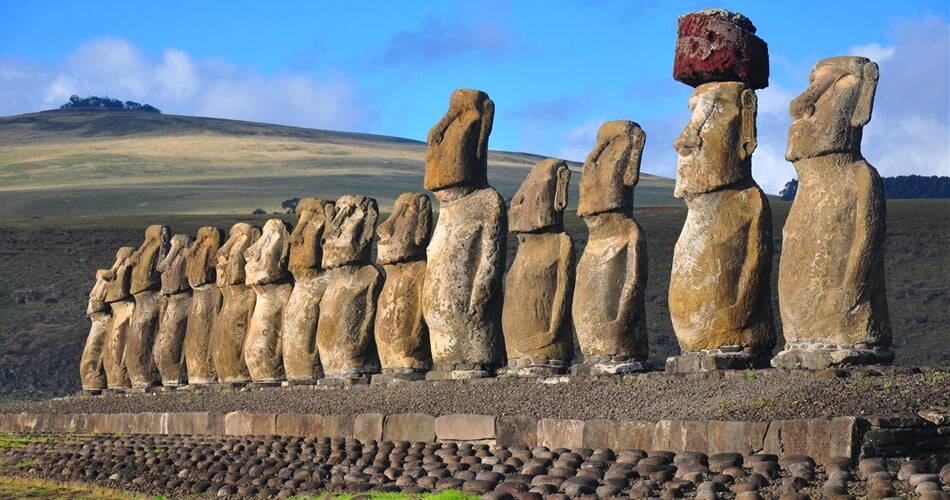 Group of 15 restored moai at Tongariki, Easter Island, in the afternoon sunshine_shutterstock_866725271