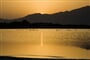 Západ slunce zrcadlící se v moři, Villasimius, Sardinia